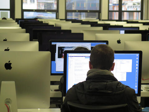 Student looking at Mac computer screen